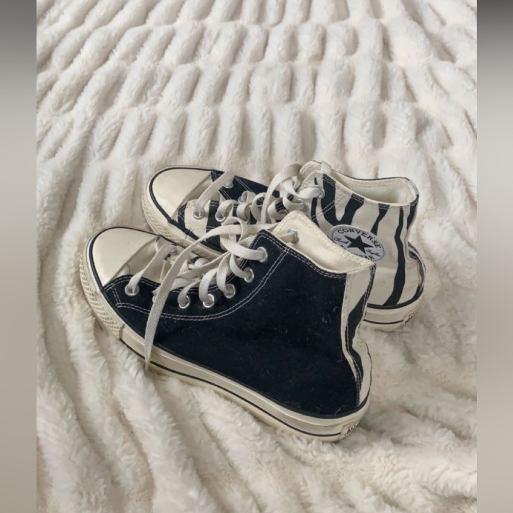 half zebra, half black platform converse